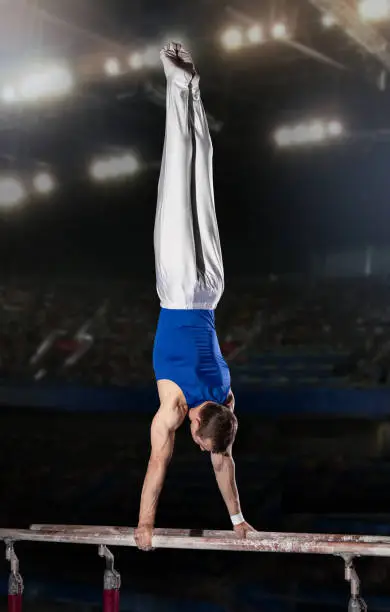 Photo of portrait of young man gymnasts