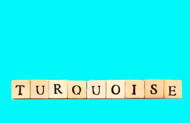 istock TURQUOISE: Written in Wood Block Letters, Turquoise Background 699804678