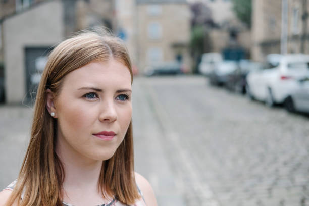 istock serious candid portrait in an urban setting. 699808710