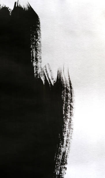 istock Black Ink Conveyed Over White Close-up Paper. 699808948