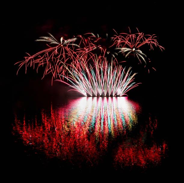 istock Firework. Beautiful colorful fireworks on the water surface with a clean black background. Fun festival and contest of Firefighters  Brno Dam - Czech Republic. 699817170