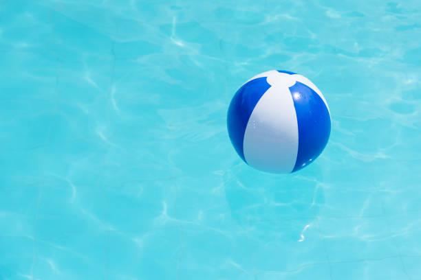 istock Floating blue and white beachball in swimming pool. 699817202