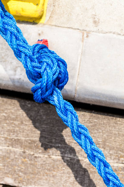 istock Blue sailing rope tied with knots 699817666