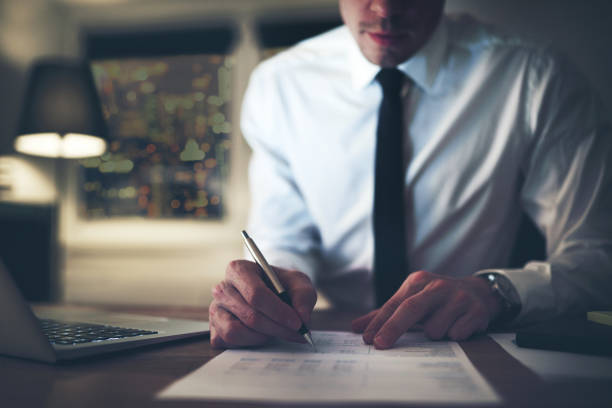 istock Serious businessman signing contract 699818252