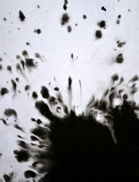istock Black Ink Conveyed Over White Close-up Paper. 699818460