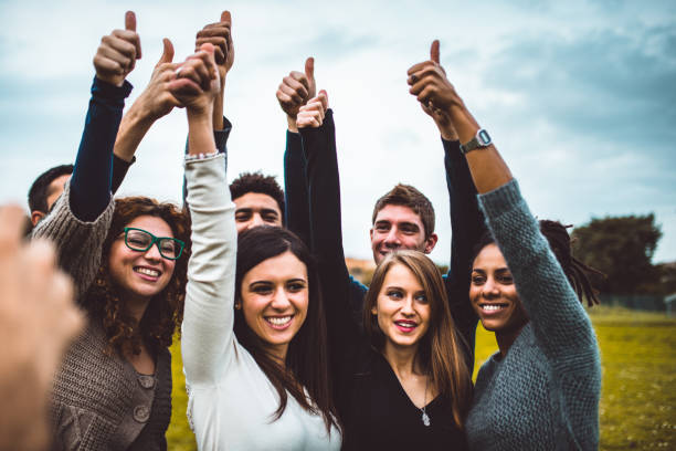 istock happiness friends thumbs up for victory 699818582