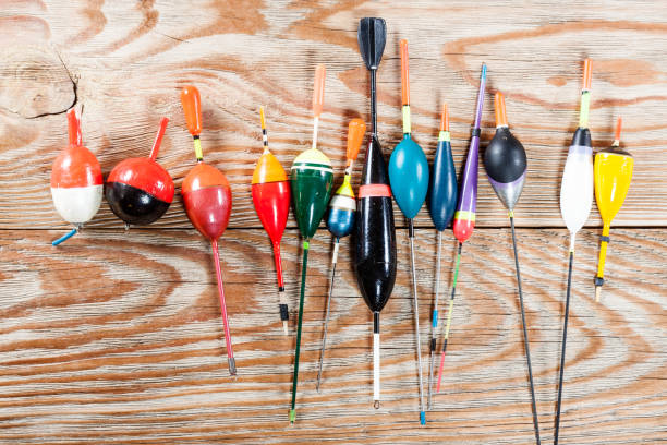 istock Fishing accessories on a wooden background. 699821832