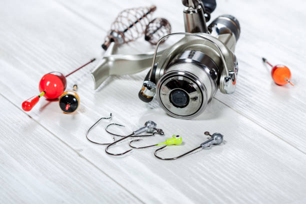 istock Fishing accessories on a wooden background. 699822284