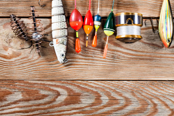 istock Fishing accessories on a wooden background. 699822678