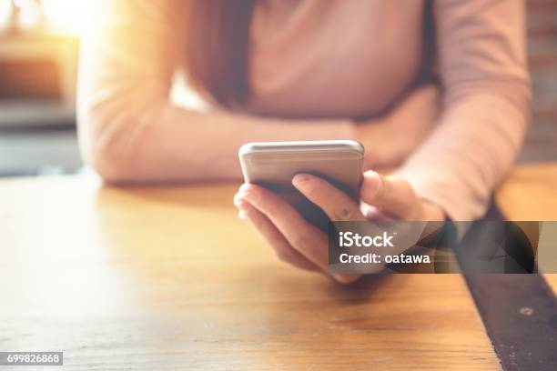 Happy Man Using Smartphone At Modern Coffee Shop Stock Photo - Download Image Now - Telephone, Text Messaging, One Woman Only