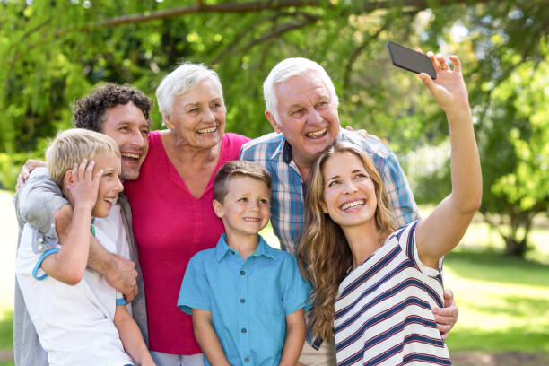 istock Smiling family taking selfie 699826894
