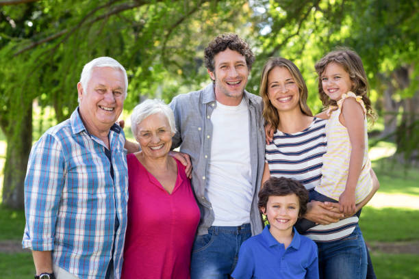 istock Smiling family standing 699827568
