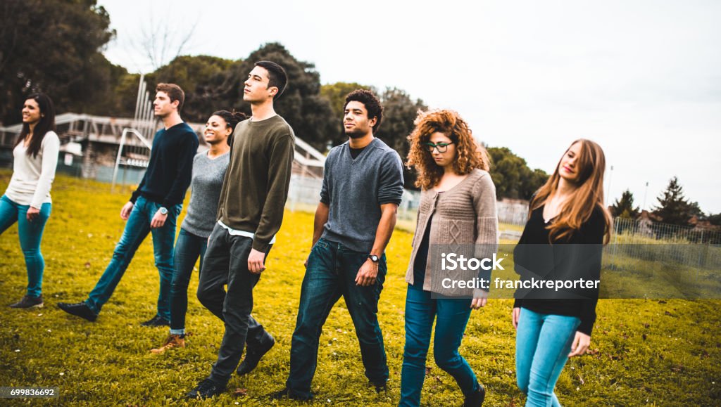 friends walking together in a park Teenage Girls Stock Photo