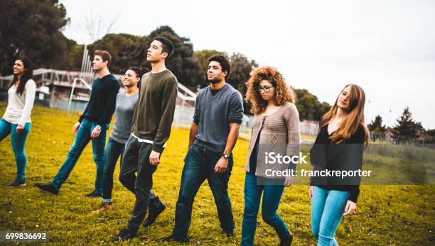 Friends Walking Together In A Park Stock Photo - Download Image Now - Teenage Girls, Teenager, Youth Culture