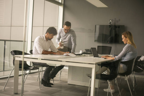 istock Business people using technology and checking document. Business people at the office. 699848096