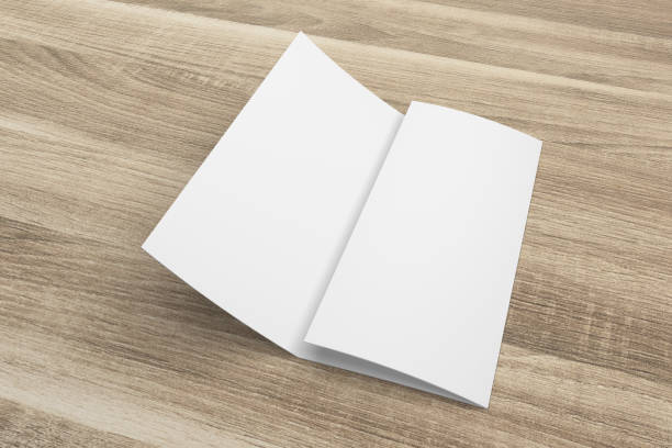 istock Blank 3D rendering tri-fold brochure mock-up with clipping path on wood No. 2 699848520