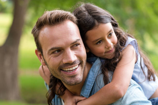 istock Young girl rides piggyback 699851538