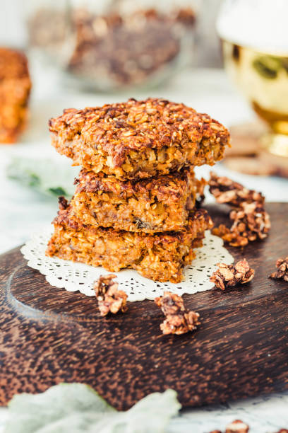 Pumpkin granola bars with peanut butter and seeds, healthy vegan snack,selective focus stock photo