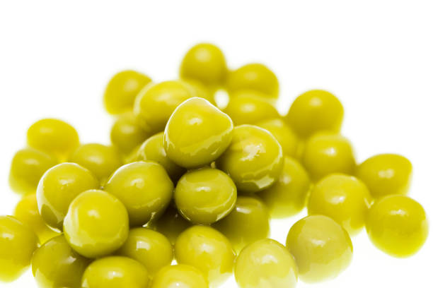 istock Pickled green peas isolated on white background 699863890