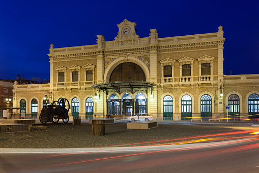 The central station in the city of Cartagena illuminated at night. Region of Murcia, Spain