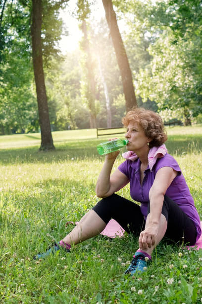 istock Senior woman exercising in the park 699874212