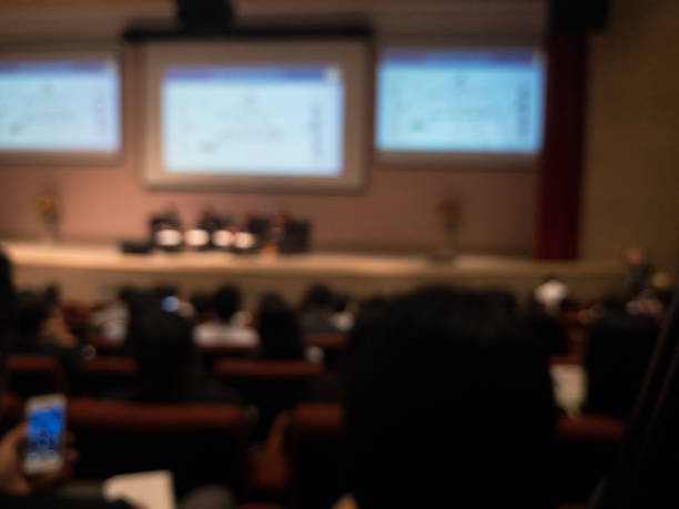 istock Abstract blurred businessman lecture in seminar room 699874778