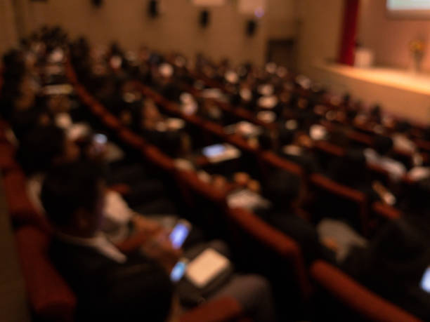 istock Abstract blurred businessman lecture in seminar room 699878192