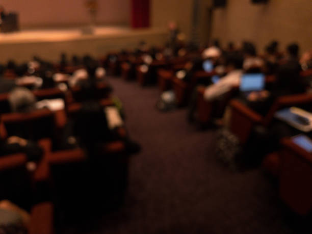 istock Abstract blurred businessman lecture in seminar room 699878564