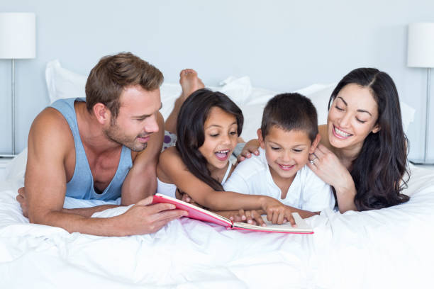 istock Happy family in their bedroom 699883032