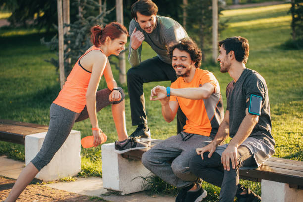 istock Sports team looking at a smart watch 699885340