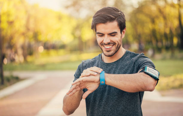 istock Sportsman looking at his smart watch 699885342