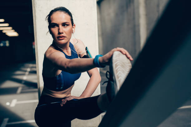 istock Sportswoman stretching outdoors 699885352