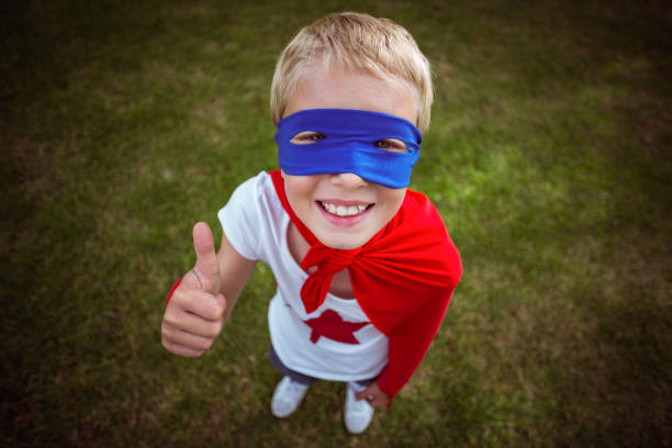istock Little boy dressed as superhero 699893934