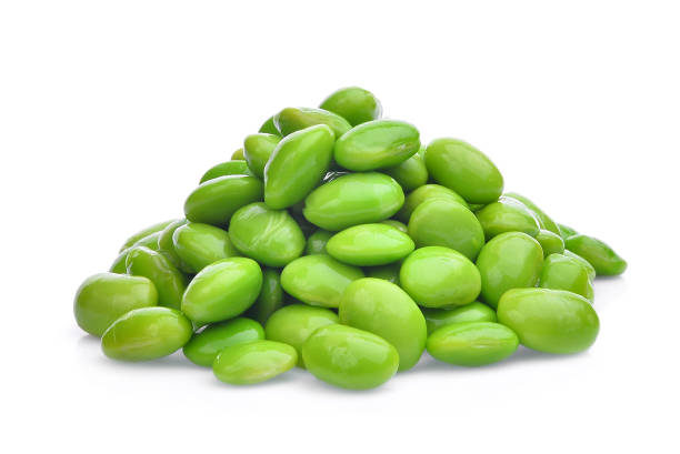 pile of edamame green beans seeds or soybeans isolated on white background - edamame imagens e fotografias de stock