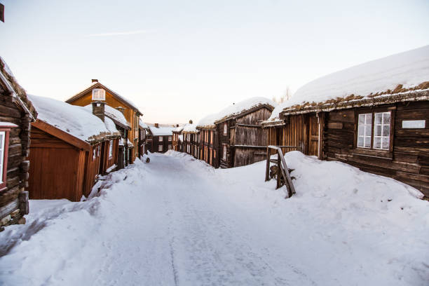 A beautiful historic street of a small Norwegian town Roros A beautiful historic street of a small Norwegian town Roros roros mining city stock pictures, royalty-free photos & images