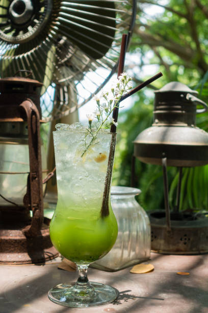 istock Kiwi soda with light and shade on vintage decoration table, 699924472