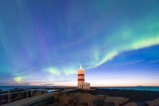 istock Aurora Borealis over the lighthouse in Iceland. 699938574