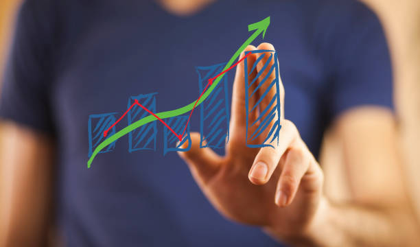 istock businessman with financial symbols 699939246