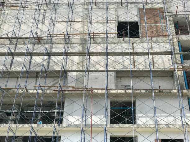 istock crane construction and scaffolding of building 699947228