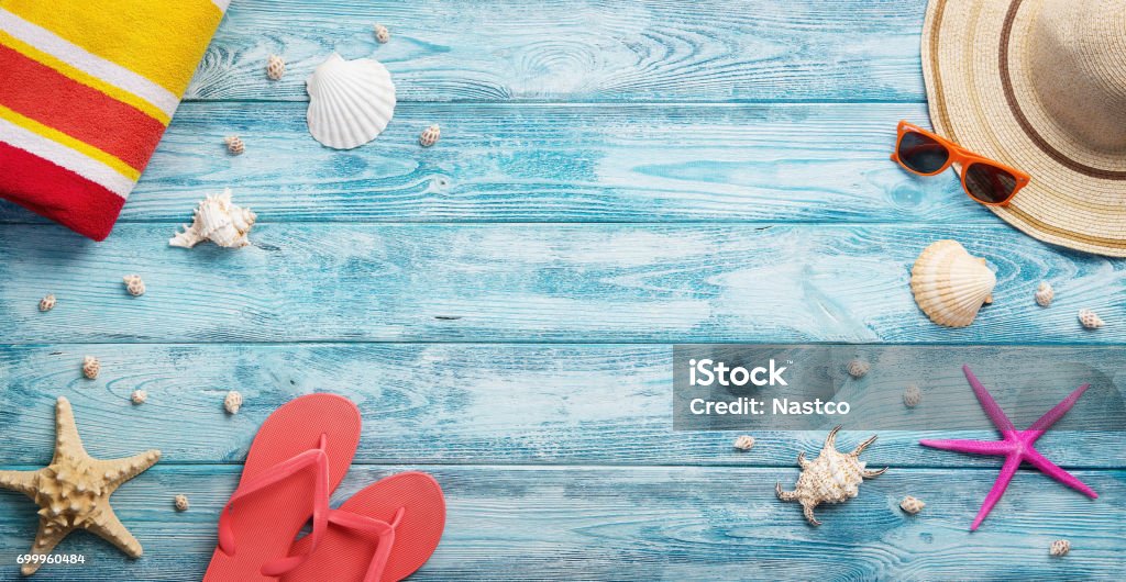 Panoramic summer background High angle view of summer, vacation, beach accessories on blue wooden background with copy space Summer Stock Photo