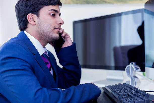 istock Young Entrepreneur working from his new cubicle 699975734