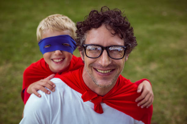istock Father and son dressed as superman 699978354