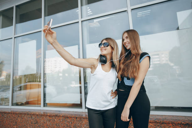 istock girls with headphone 699999474
