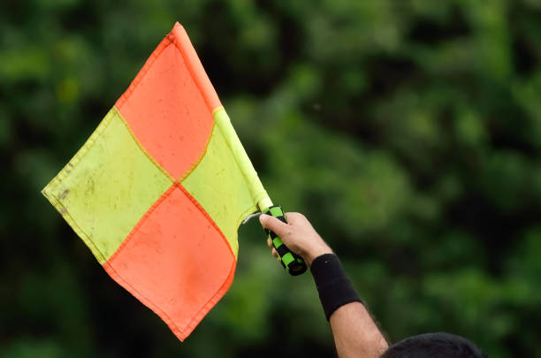 Soccer assistant referee Soccer assistant referee raise flag offside stock pictures, royalty-free photos & images