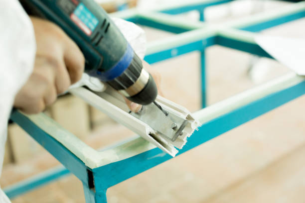 istock Plastic window assembly. Manufacture of plastic windows. 700056102
