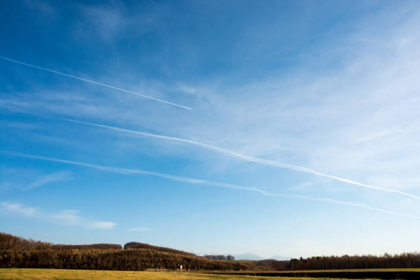 istock Vapor trails in the autumn sky 700076794