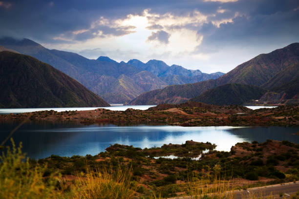 Lake near Potrerillos, RN7, Andes, Argentina View of lake near Potrerillos and Andes mountains in summer day, Mendoza province, Andes, Argentina foothills parkway photos stock pictures, royalty-free photos & images