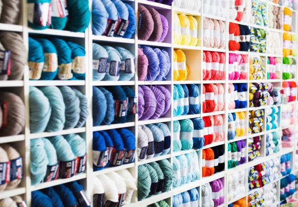 istock Variegated yarns for knitting on shop shelf 700081030
