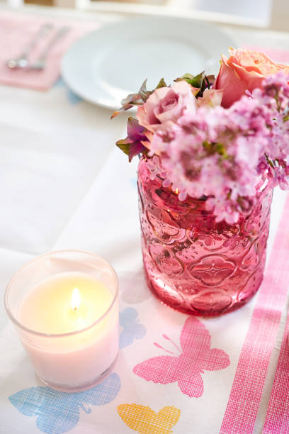 istock Table decoration for bithday party with flowers, candles und dishes 700085036