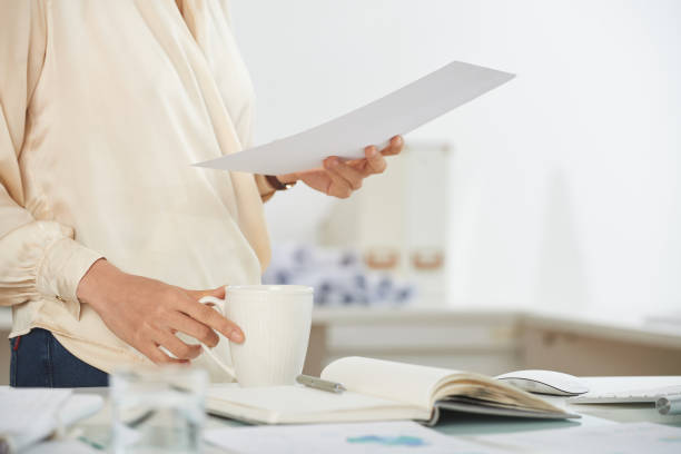 istock Elegant businesswoman with document 700087710